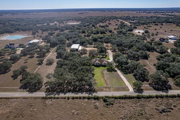 an aerial view of a house with a garden