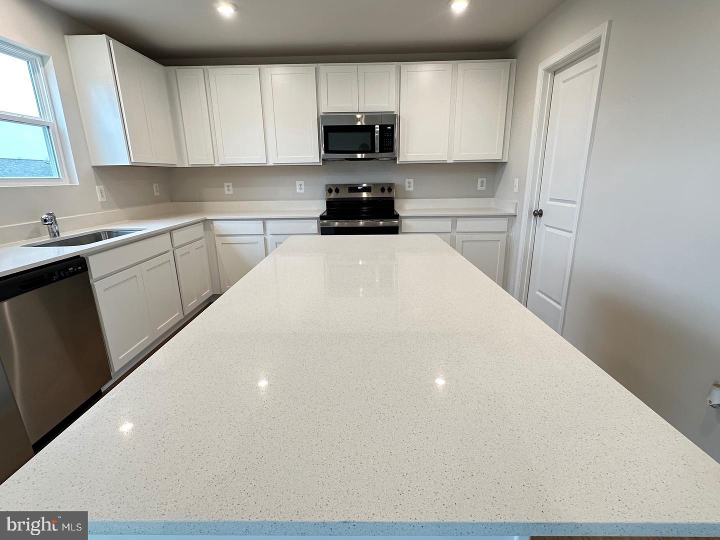 36 Patterson Road Charles Town, WV 25414 - Photo 8 of 37 White cabinets, quartz countertops.
