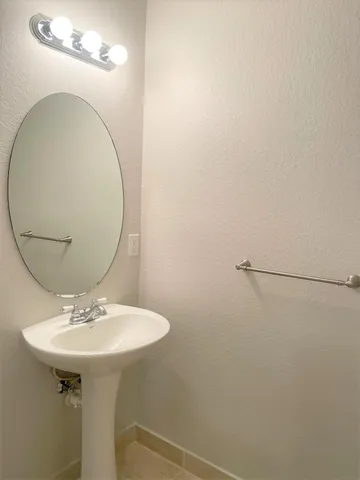 a view of a hallway view with wooden floor