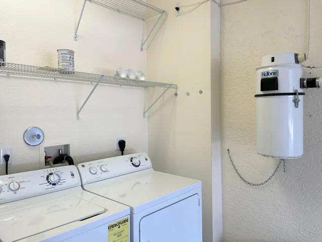 a view of a house with a yard and garage