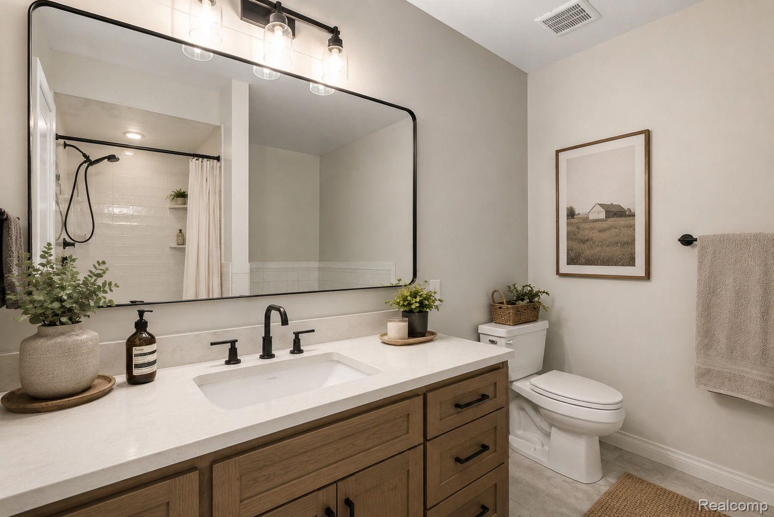 76565 McFadden Road Armada, MI 48005 - Photo 28 of 95 Modern vanity featuring a white countertop and natural wood-finish cabinetry