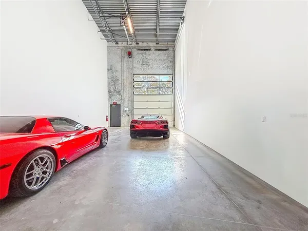 a bedroom with a bed and a chair