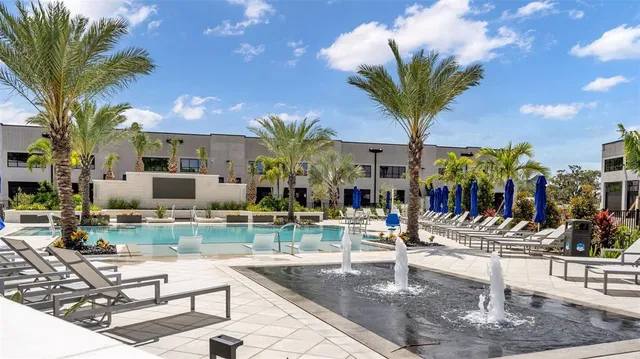 a view of swimming pool from a balcony