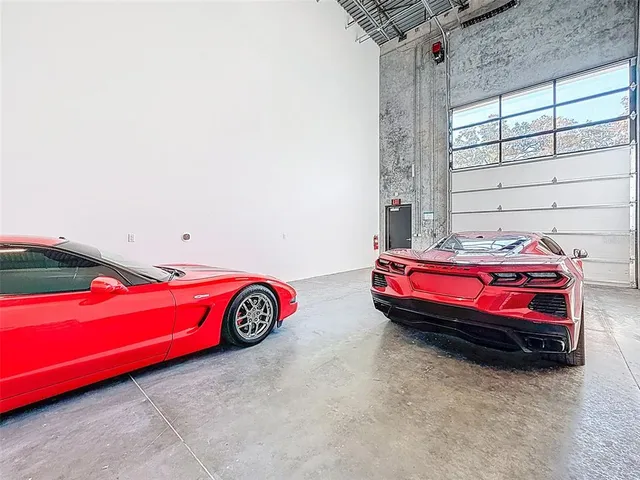 a car parked in a room next to a window