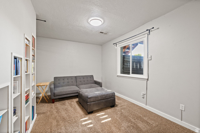 594 850 West Provo, UT 84601 - Photo 27 of 33 Carpeted room featuring a single window, built-in shelving, and recessed ceiling lighting