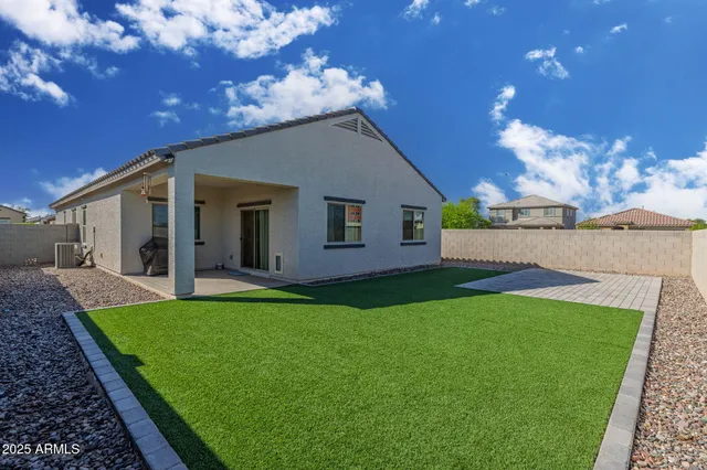 a view of a house with a yard porch and sitting area