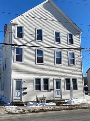 a front view of a house with yard