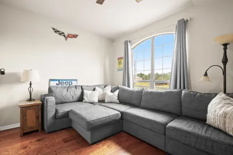 a living room with furniture and a window