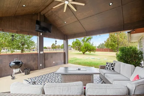 a outdoor living space with furniture and garden view