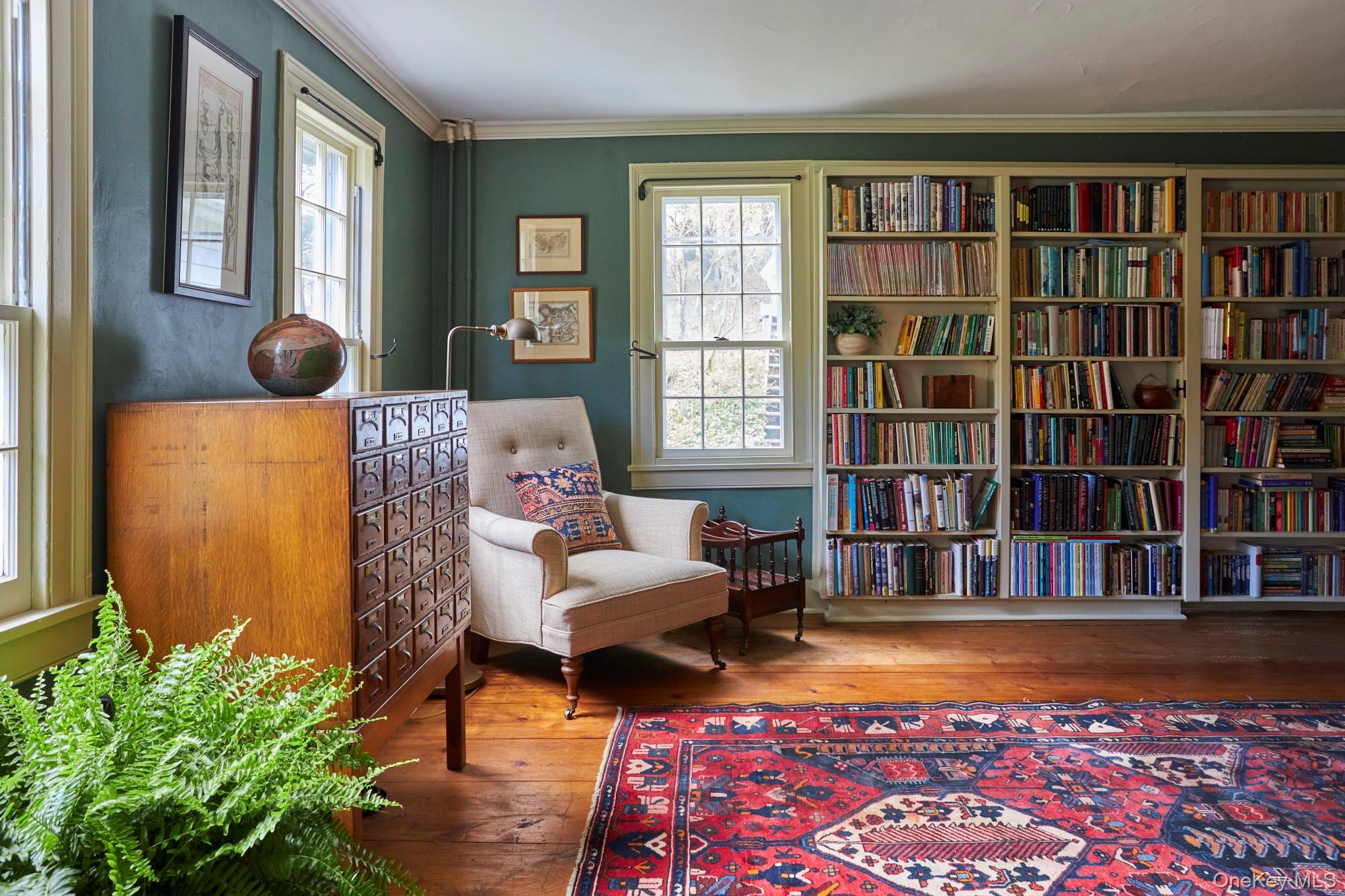 457 Round Lake Road Rhinebeck, NY 12572 - Photo 13 of 25 a living room with furniture and a bookshelf