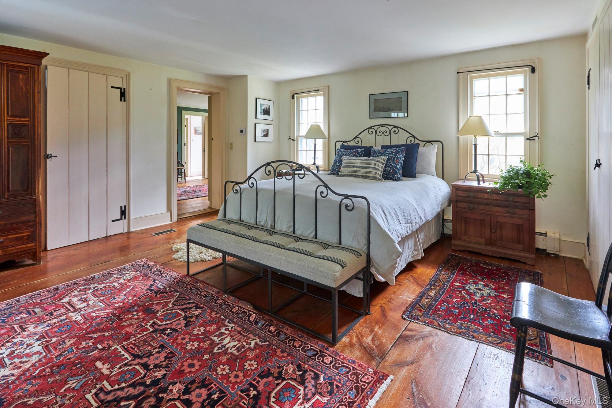 457 Round Lake Road Rhinebeck, NY 12572 - Photo 19 of 25 a bedroom with a bed and wooden floor