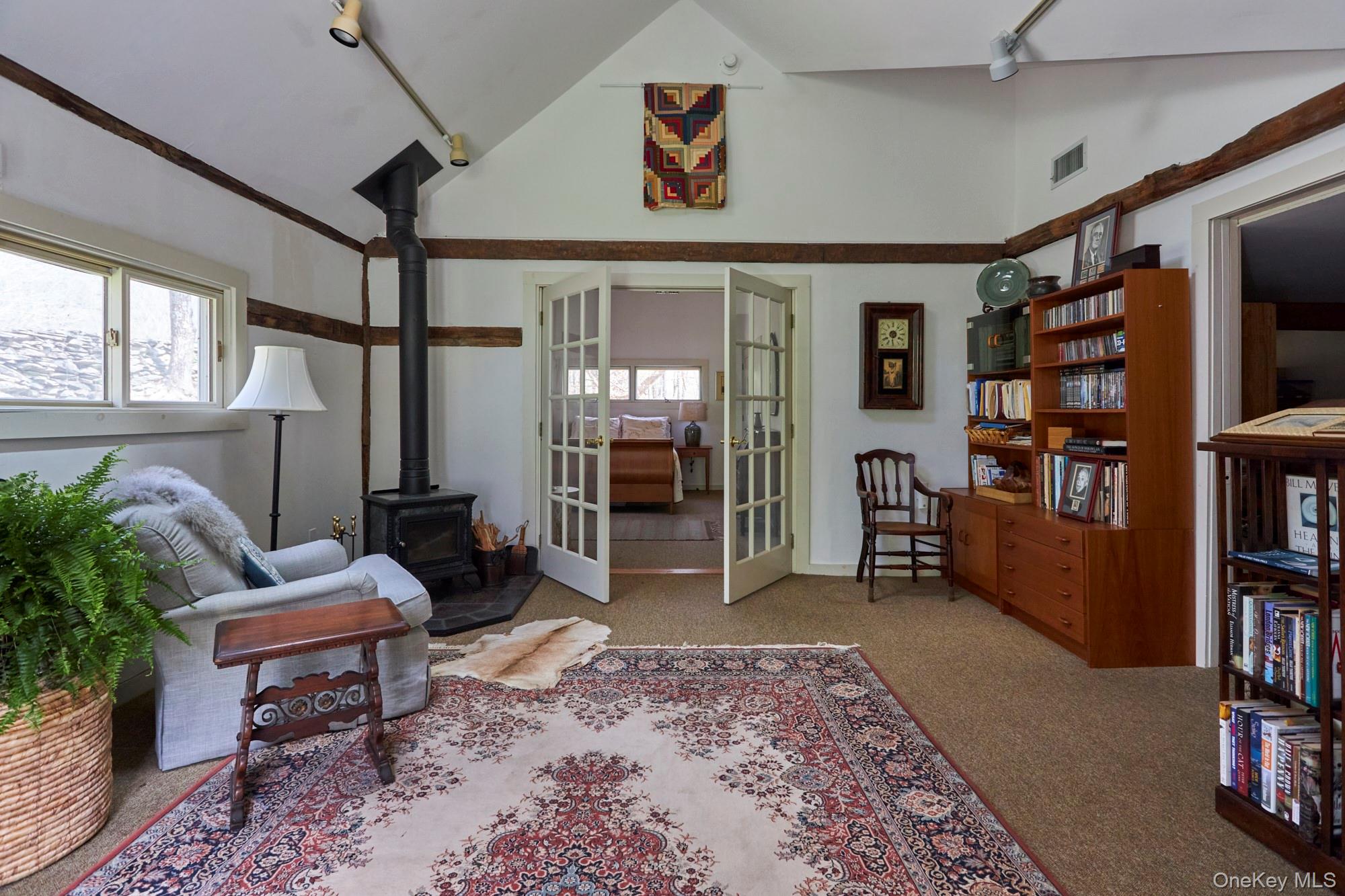 457 Round Lake Road Rhinebeck, NY 12572 - Photo 20 of 25 a living room with furniture and a book shelf