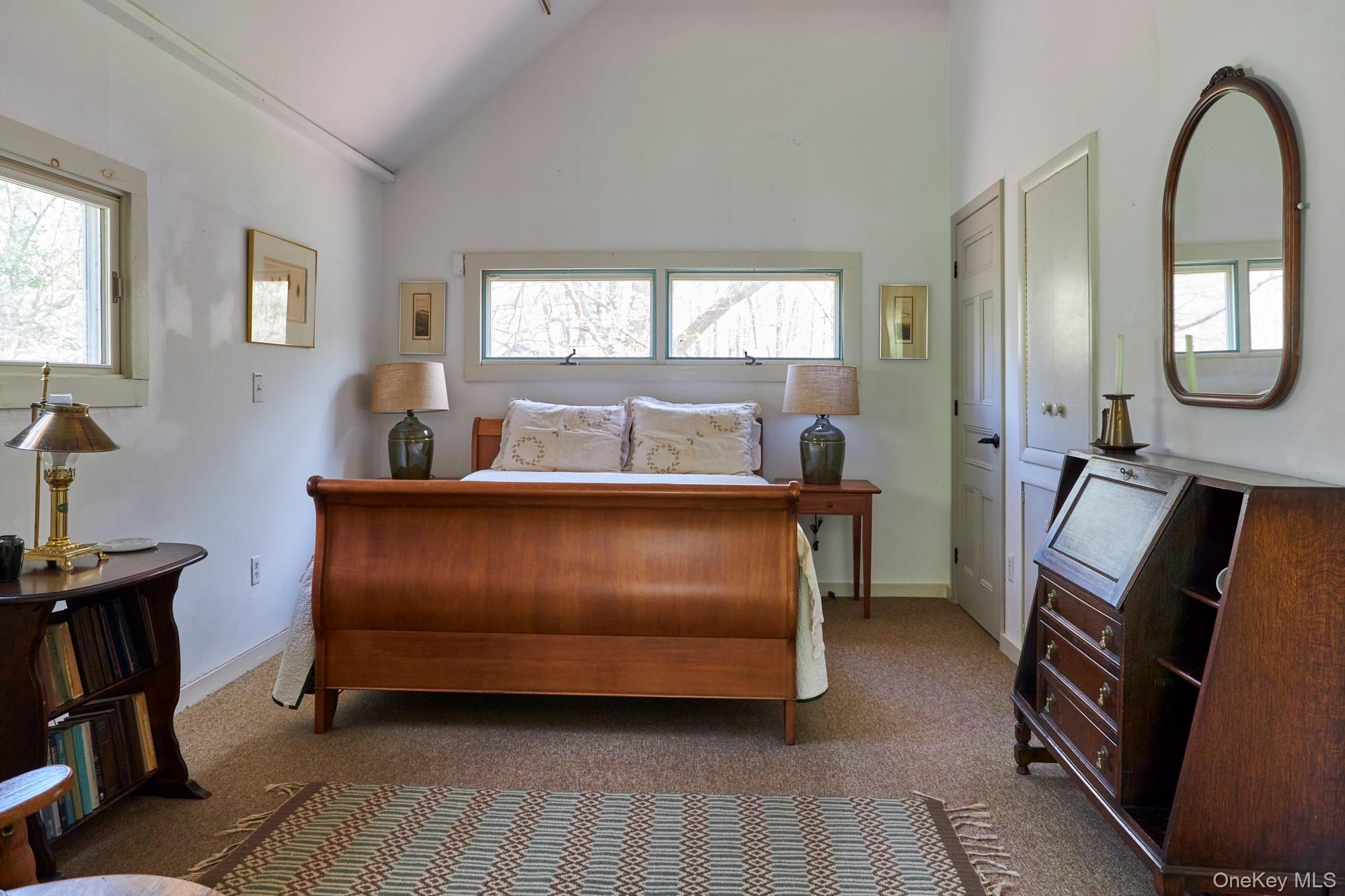 457 Round Lake Road Rhinebeck, NY 12572 - Photo 21 of 25 a bed room with a bed and a mirror
