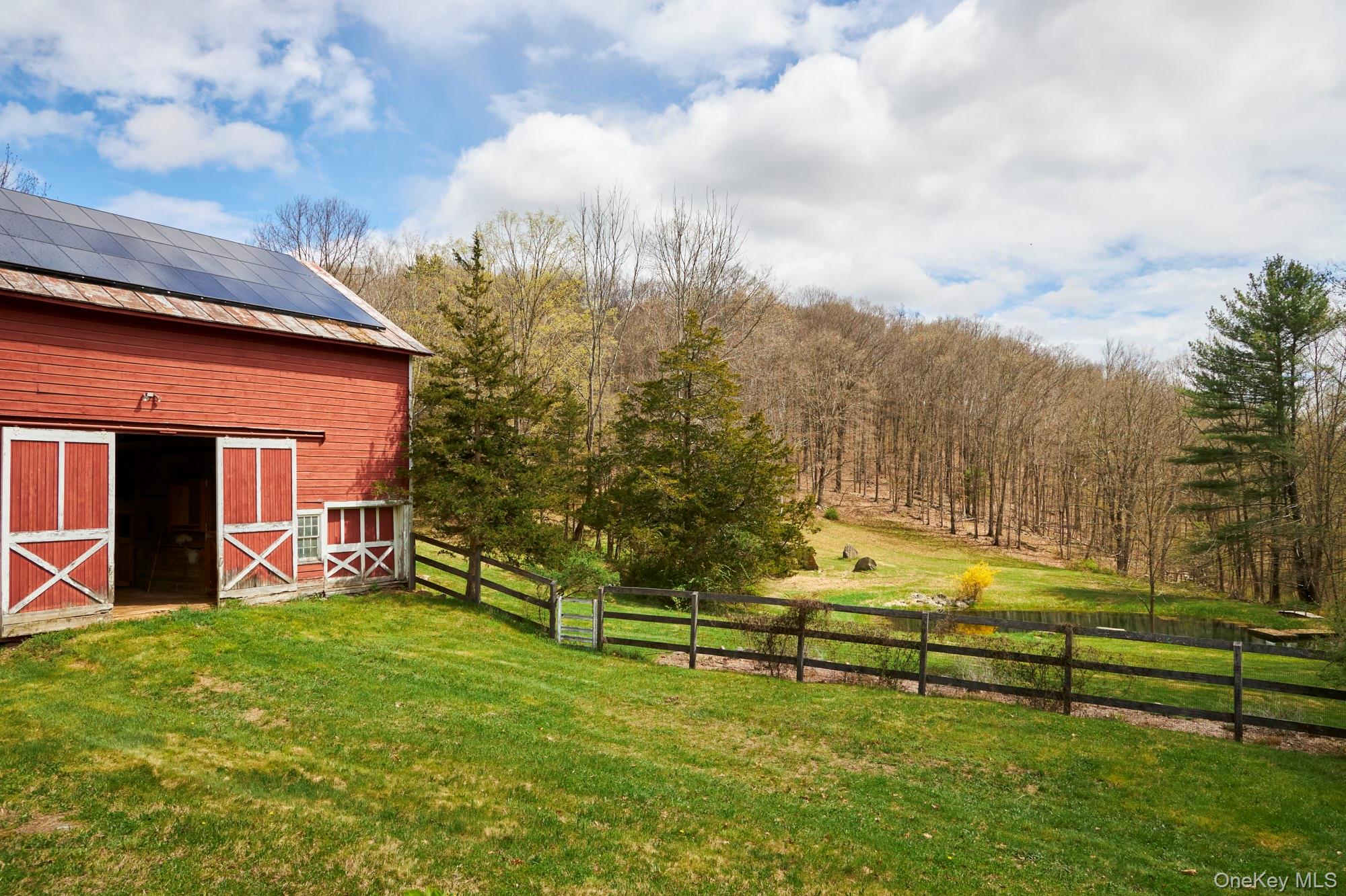 457 Round Lake Road Rhinebeck, NY 12572 - Photo 6 of 25 a view of a house with a yard