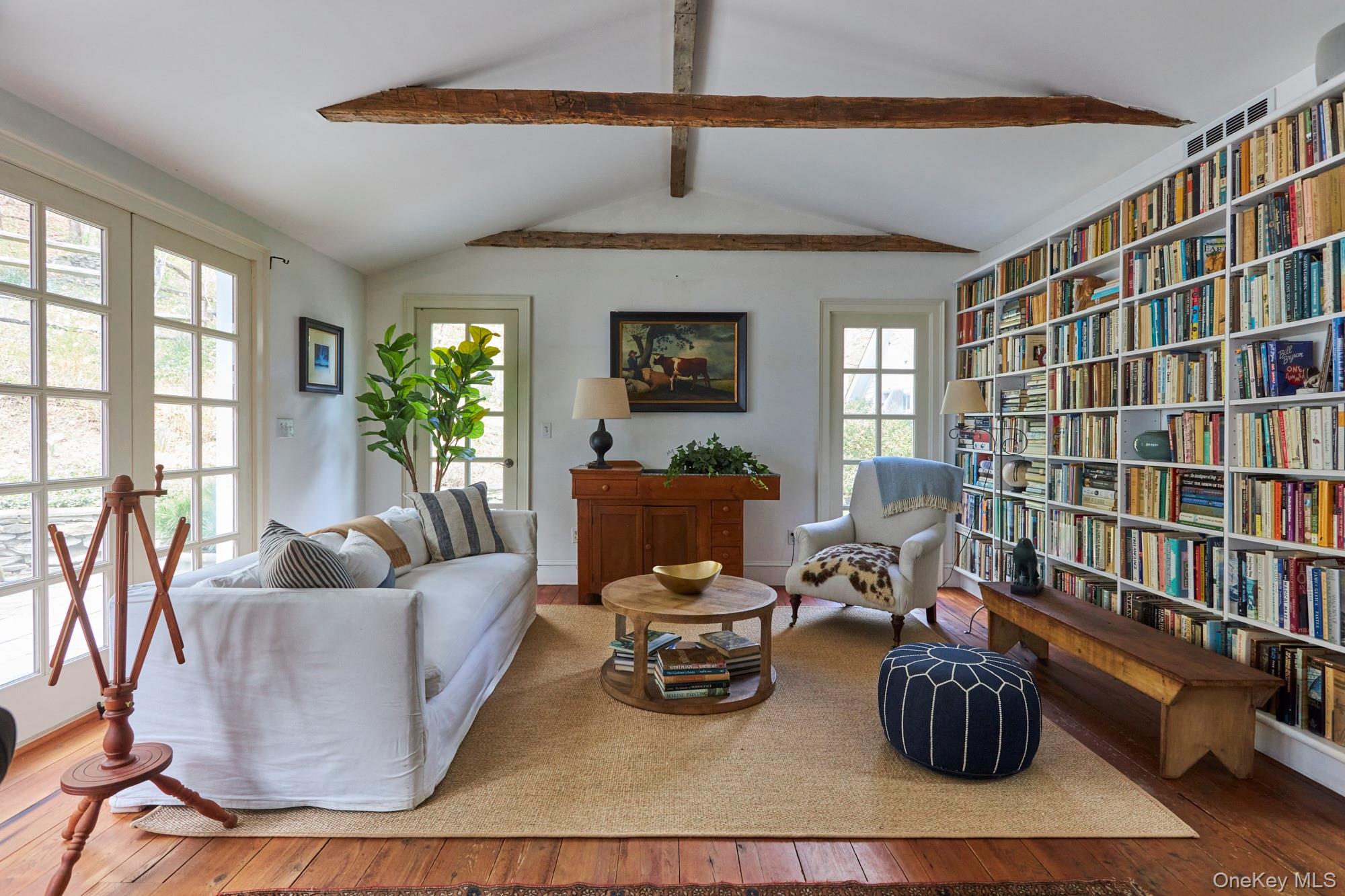 457 Round Lake Road Rhinebeck, NY 12572 - Photo 7 of 25 a living room with furniture and a wooden floor