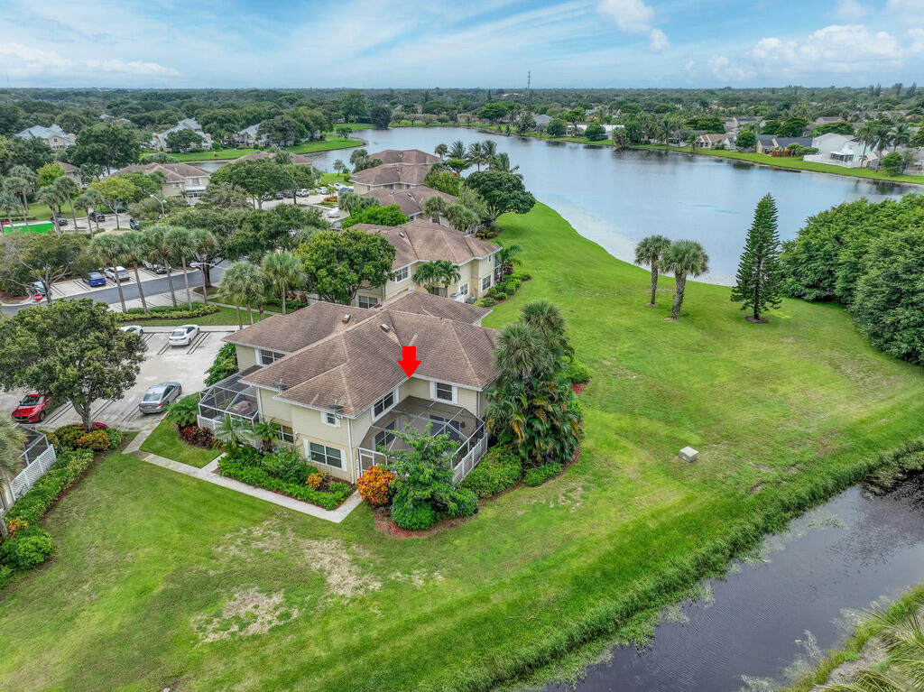 4102 Roxbury Court, Unit 41B Boynton Beach, FL 33436 - Photo 1 of 24 an aerial view of residential houses with outdoor space and lake view