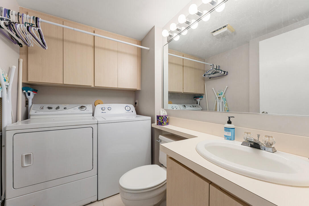 4102 Roxbury Court, Unit 41B Boynton Beach, FL 33436 - Photo 13 of 24 a bathroom with a sink a toilet and vanity