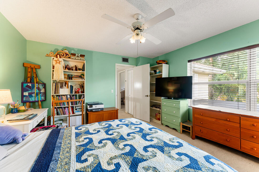 4102 Roxbury Court, Unit 41B Boynton Beach, FL 33436 - Photo 15 of 24 a bedroom with furniture and a flat screen tv