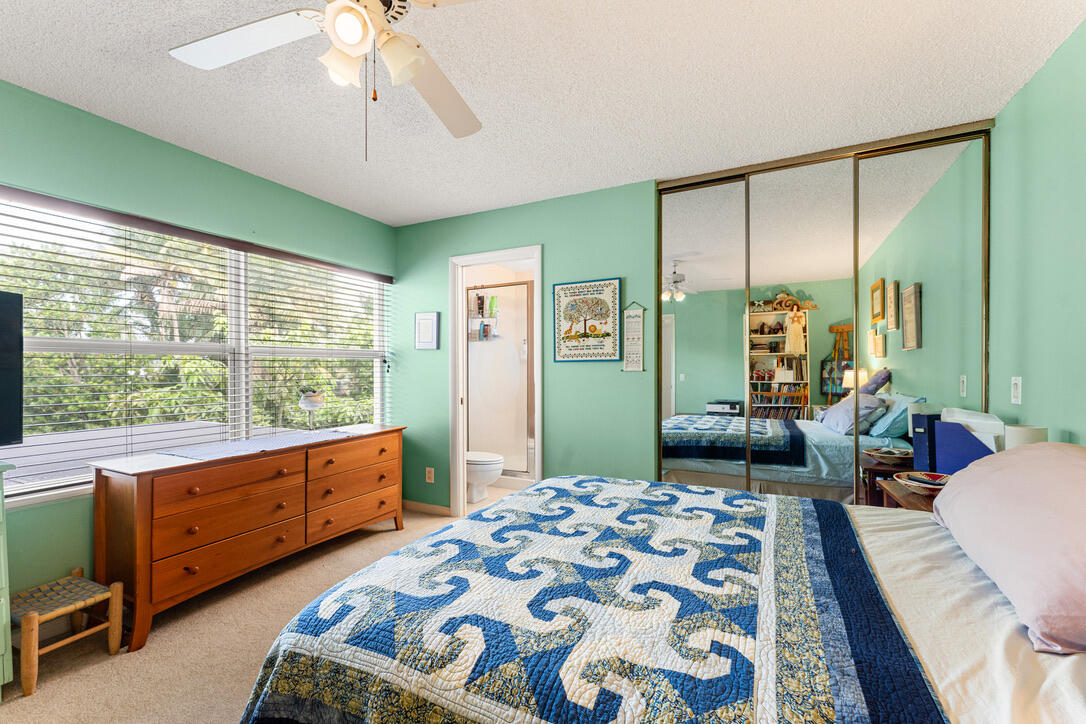 4102 Roxbury Court, Unit 41B Boynton Beach, FL 33436 - Photo 17 of 24 a bedroom with a bed and large windows