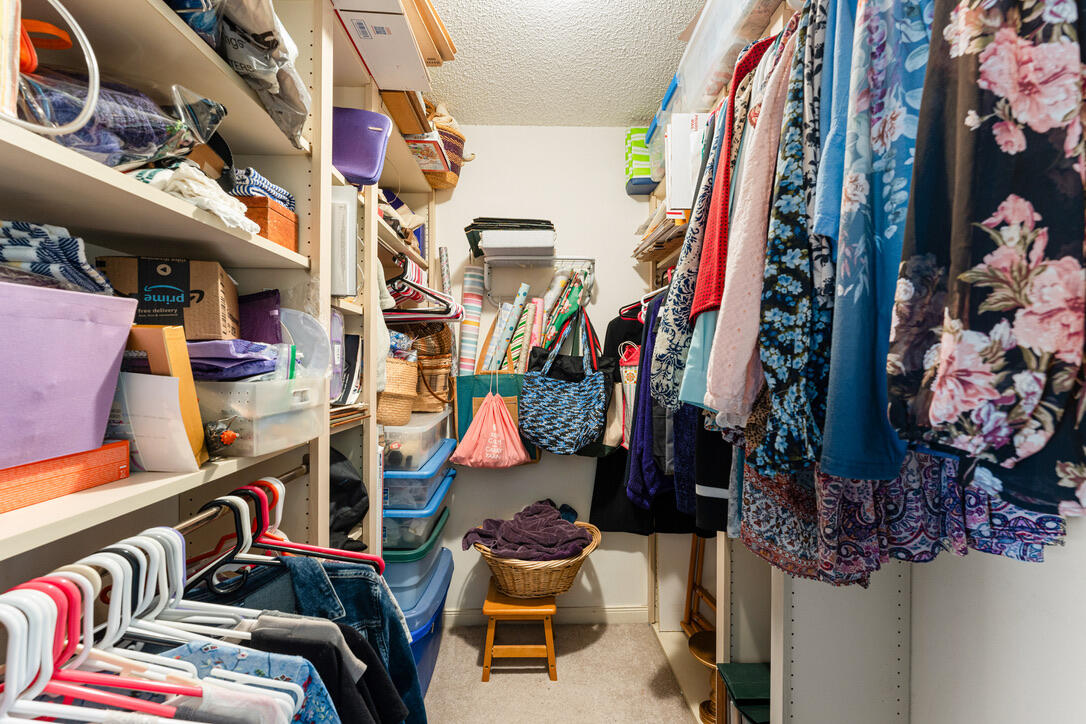 4102 Roxbury Court, Unit 41B Boynton Beach, FL 33436 - Photo 18 of 24 a view of walk in closet with clothes and shoes