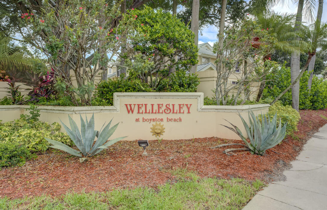 4102 Roxbury Court, Unit 41B Boynton Beach, FL 33436 - Photo 2 of 24 a sign on the side of the road