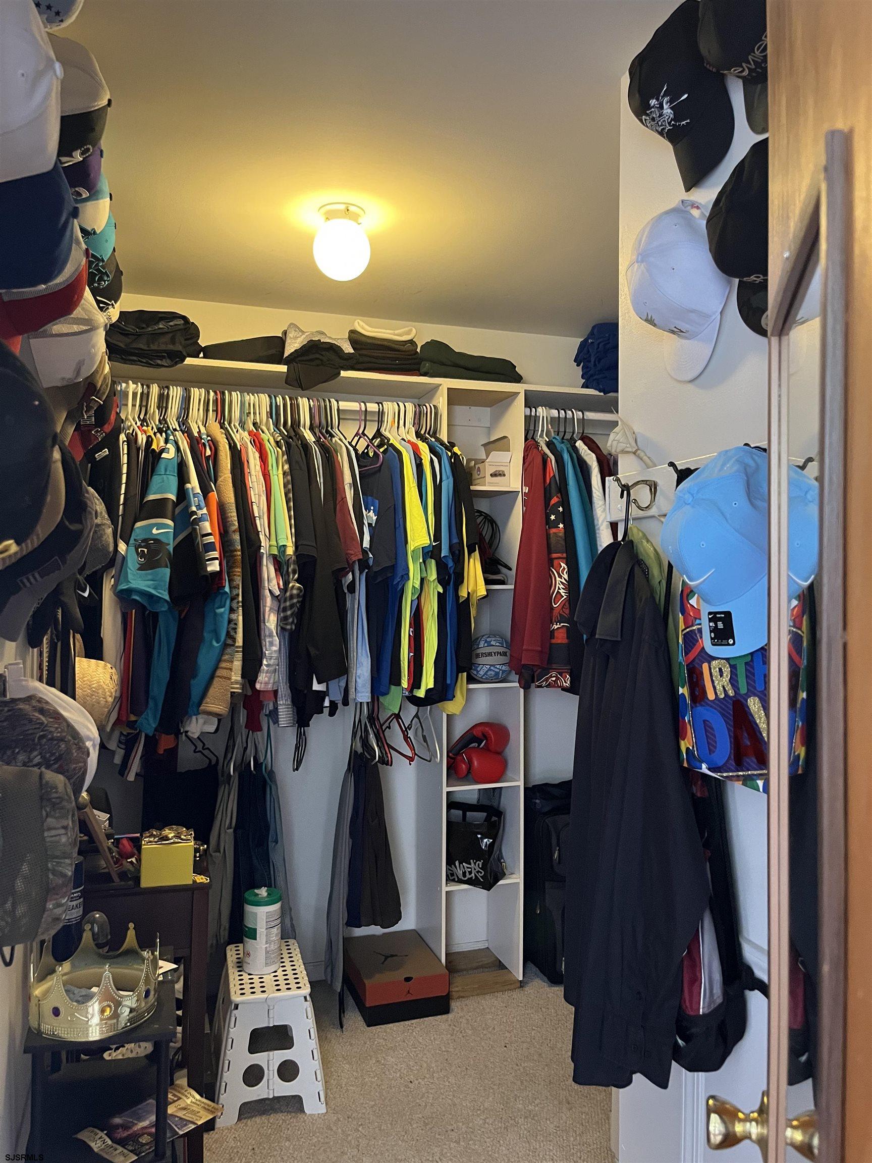 7 Compton Lane Egg Harbor Township, NJ 08234 - Photo 17 of 37 a view of walk in closet with clothes and shoes