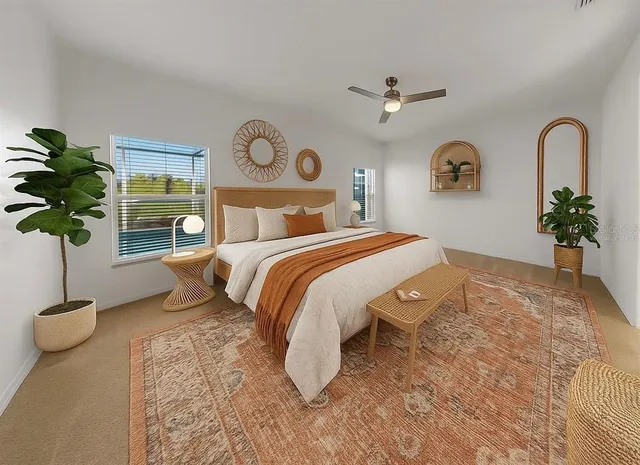 a bedroom with a bed and a potted plant