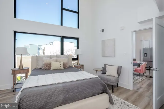 a bedroom with a bed and a chair