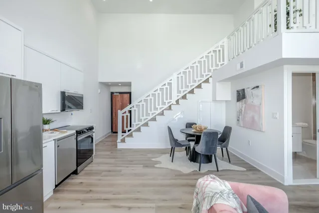 a dining room with furniture and entryway