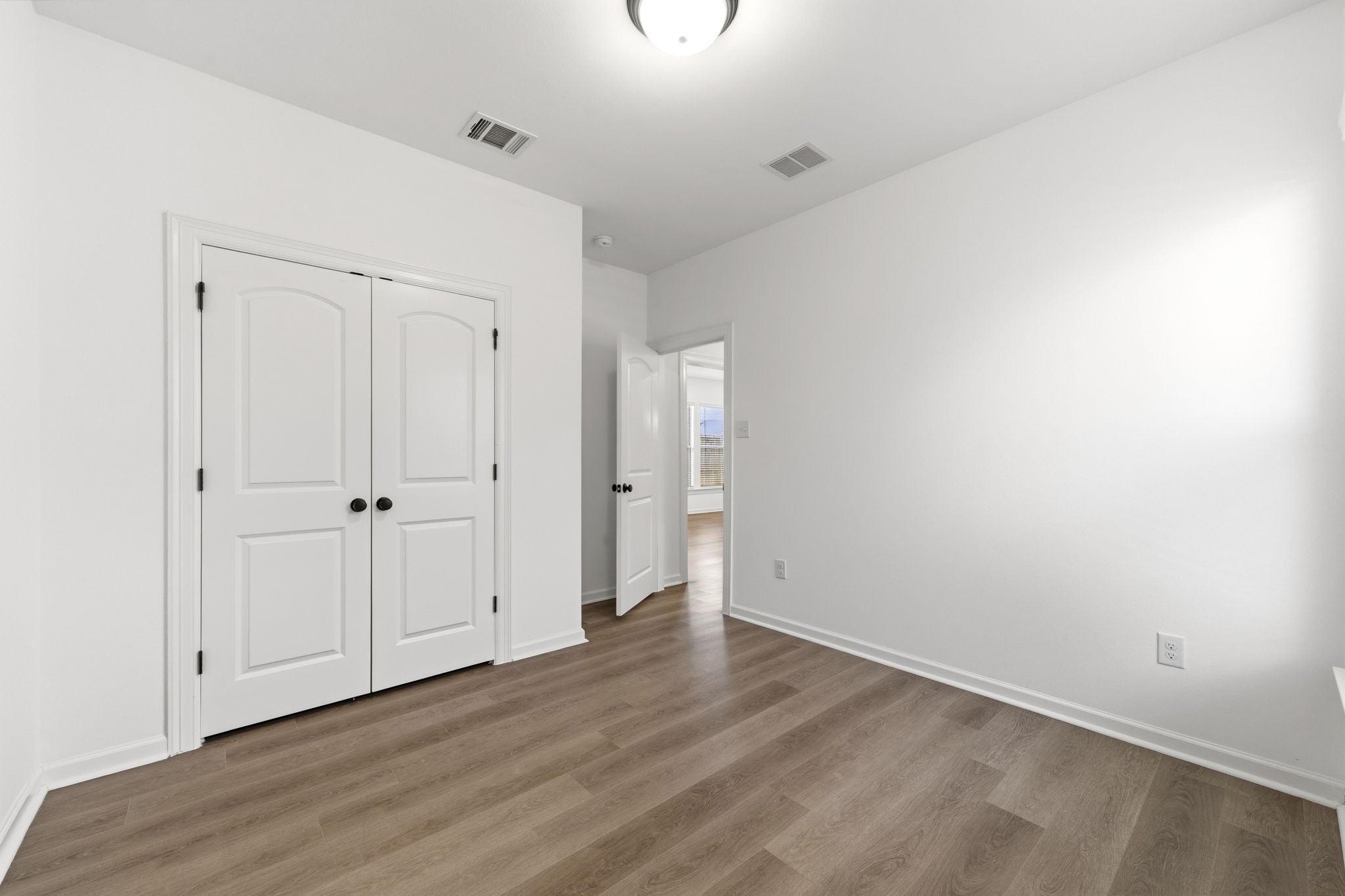 10934 Bonfire Trail Beasley, TX 77417 - Photo 20 of 32 Comfortable secondary bedroom with modern finishes and a spacious closet