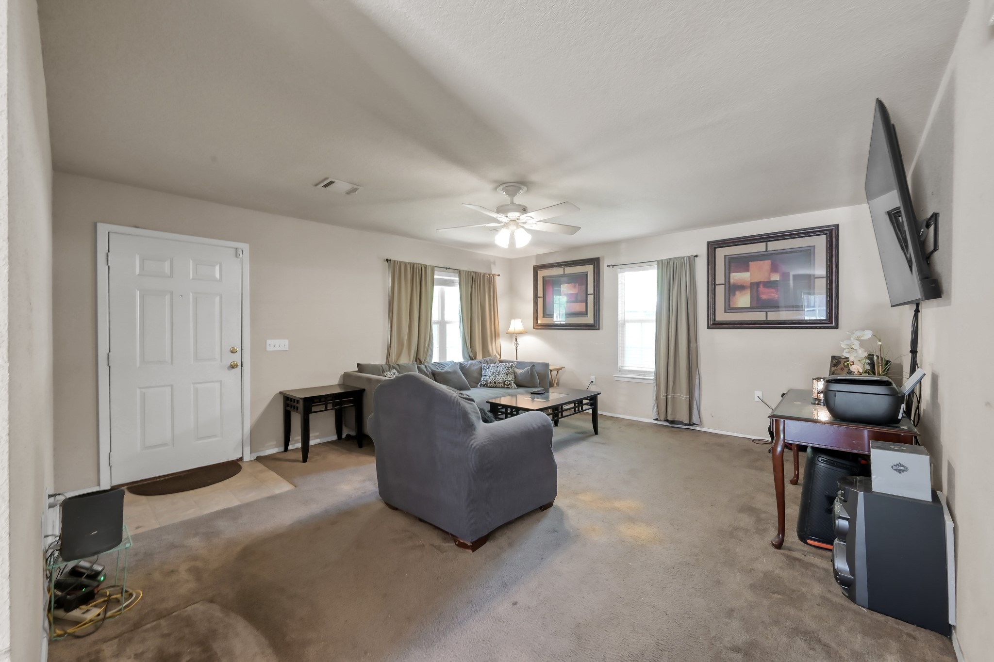 805 Webb Street Conroe, TX 77301 - Photo 5 of 19 a living room with furniture and a window