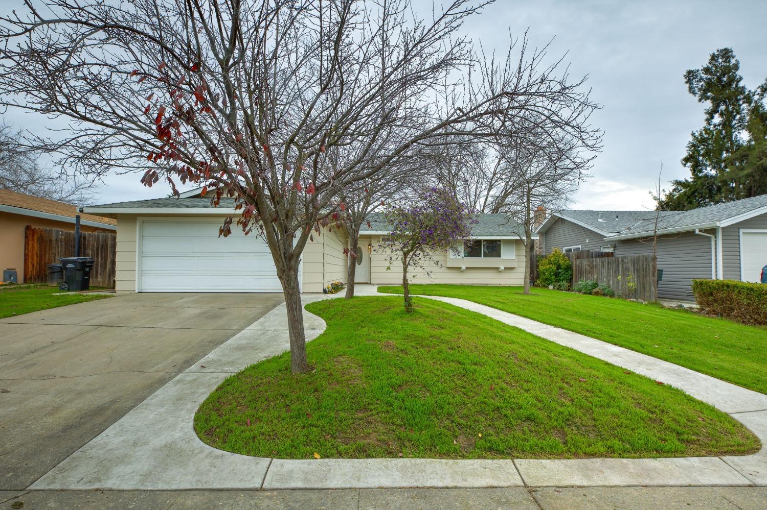 4852 Willowbrook Drive Sacramento, CA 95842 - Photo 1 of 1 front view of a house with a yard