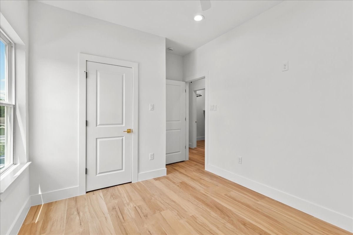8323 Observatory Street, Unit A/B Houston, TX 77088 - Photo 13 of 38 Unit A - The secondary bedroom offers a bright and comfortable space with ample room for family, guests, or a home office.