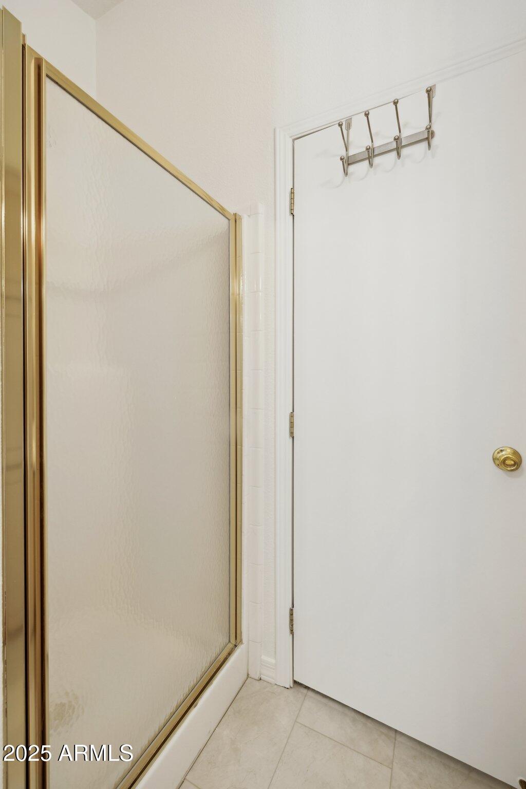 3901 East Pinnacle Peak Road, Unit 105 Phoenix, AZ 85050 - Photo 13 of 23 a bathroom with a glass shower door