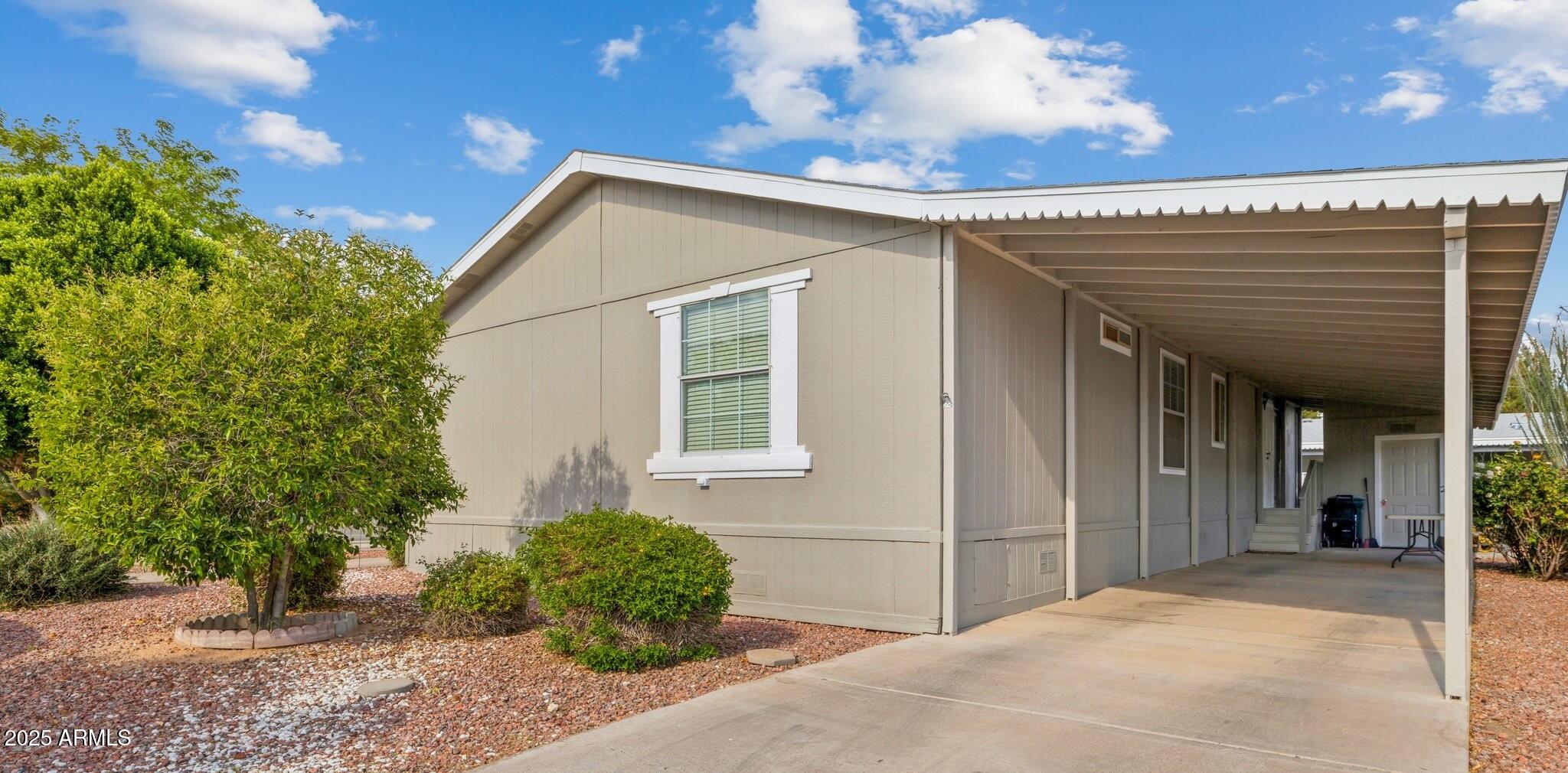 3901 East Pinnacle Peak Road, Unit 105 Phoenix, AZ 85050 - Photo 2 of 23 a view of a house with a outdoor space