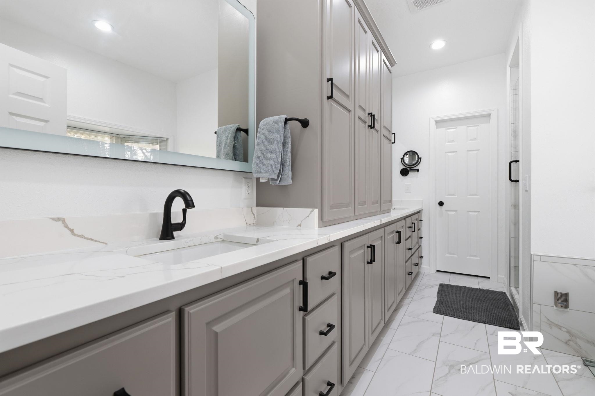 15025 Bellingrath Road Coden, AL 36523 - Photo 56 of 79 Full bath featuring double vanity, light marble finish floors, recessed lighting, and a shower stall