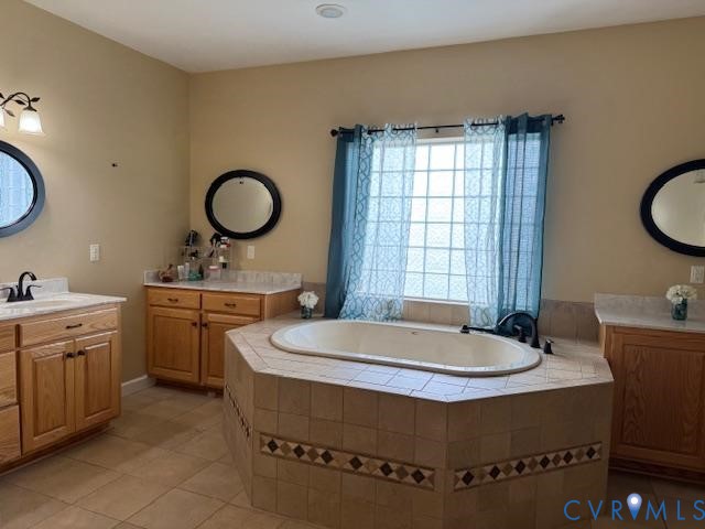 19890 River Road Courtland, VA 23837 - Photo 12 of 32 a bathroom with a granite countertop sink and a mirror