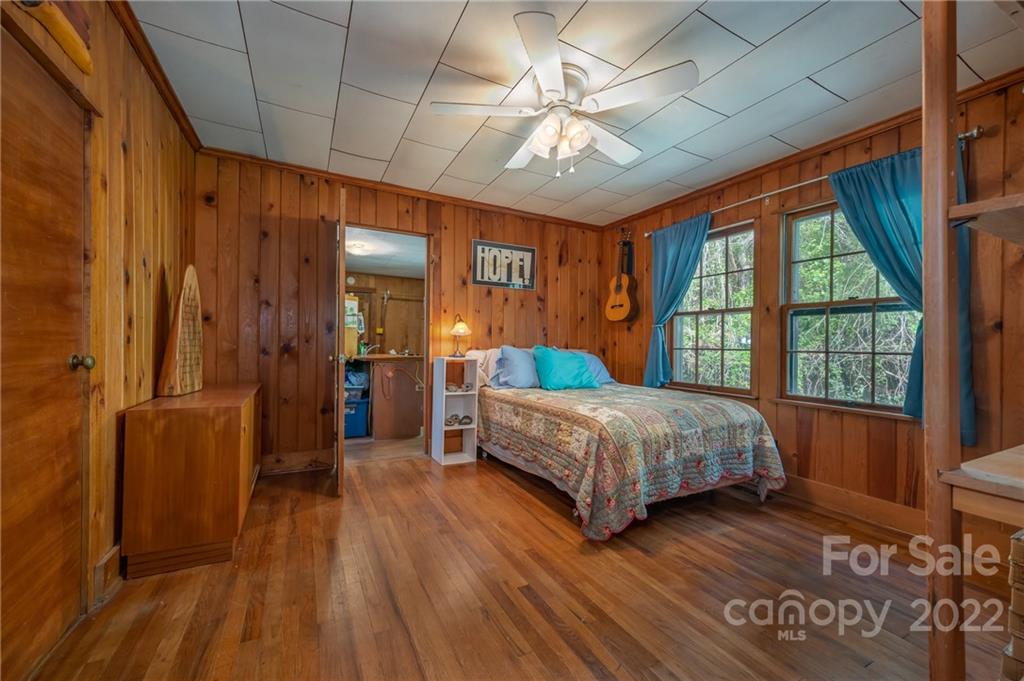 2226 Us Highway Tryon, NC 28782 - Photo 21 of 33 a bedroom with a bed and a large window
