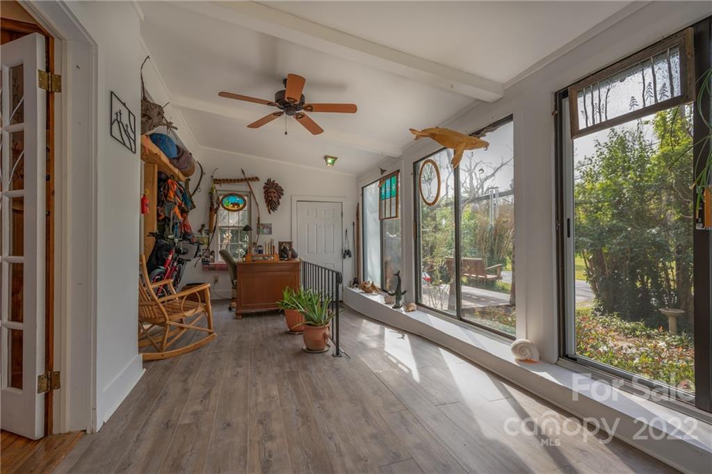 2226 Us Highway Tryon, NC 28782 - Photo 4 of 33 a living room with furniture and a floor to ceiling window