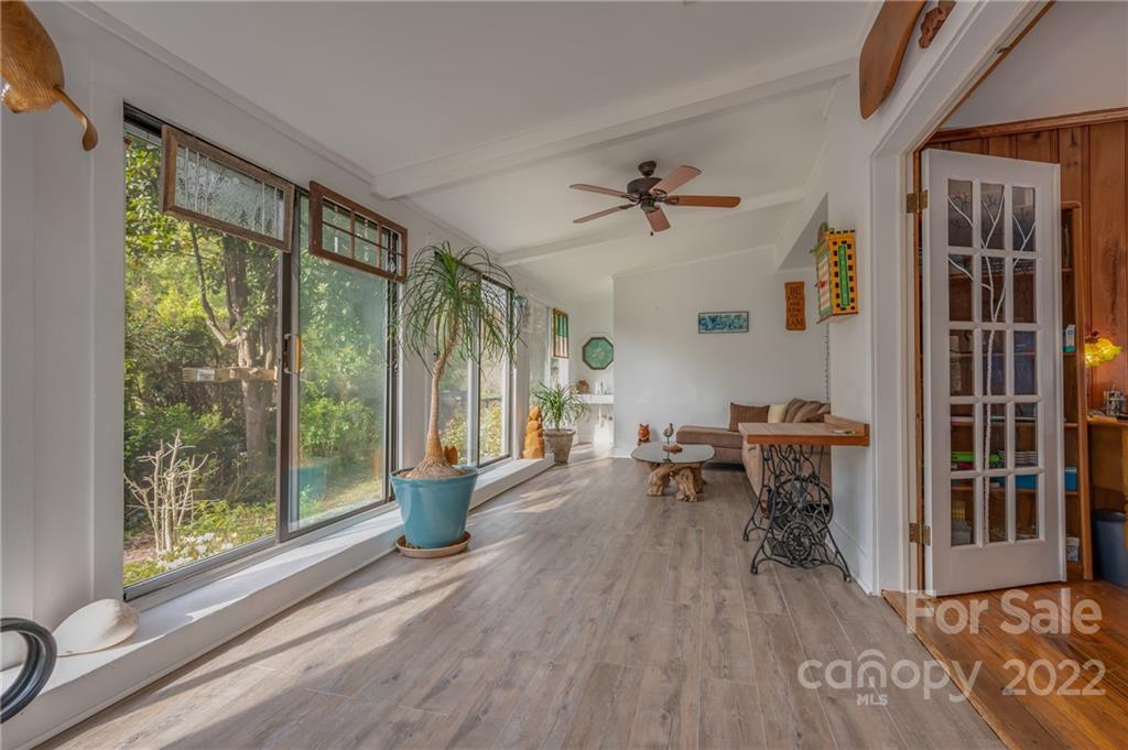 2226 Us Highway Tryon, NC 28782 - Photo 5 of 33 a view of a livingroom with furniture window and wooden floor