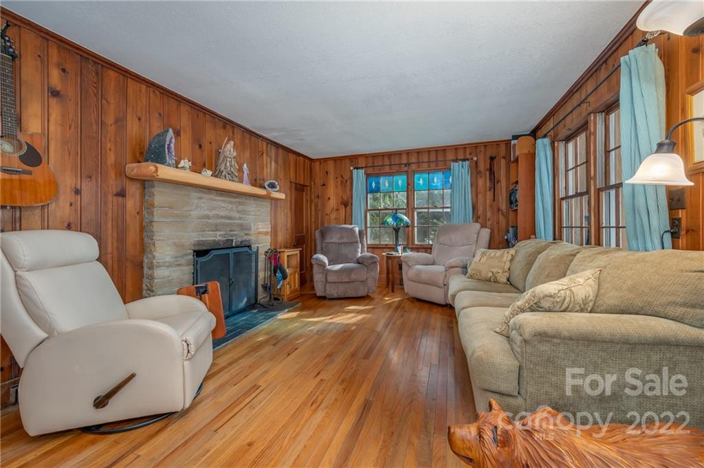 2226 Us Highway Tryon, NC 28782 - Photo 9 of 33 a living room with furniture fireplace and a large window