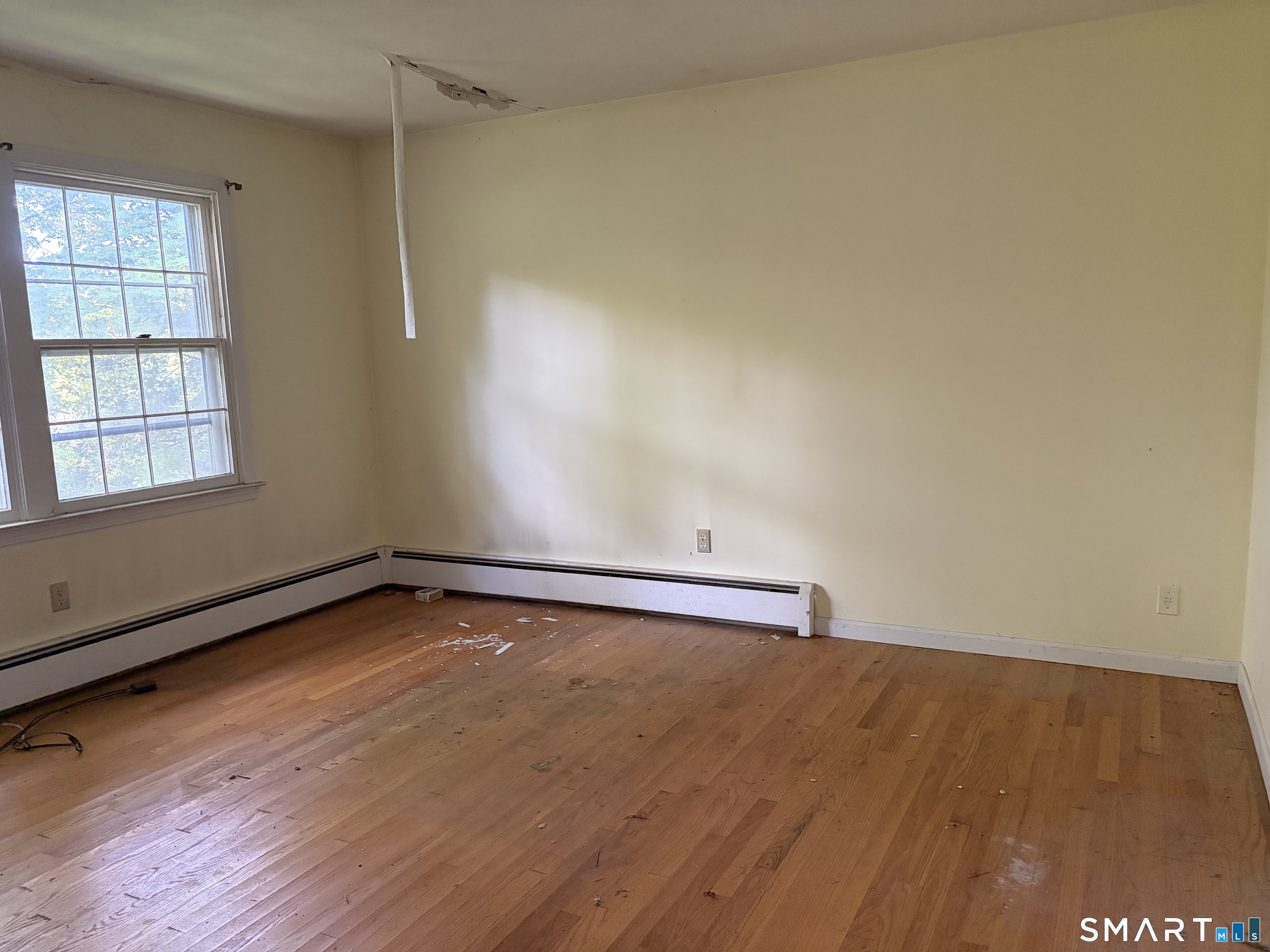 101 Partridgetown Road Naugatuck, CT 06770 - Photo 14 of 31 The expansive first floor primary bedroom features a large walk-in closet.