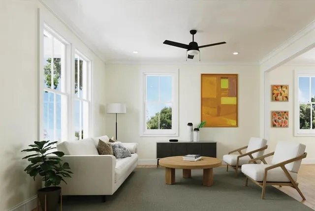 a living room with furniture and a large window