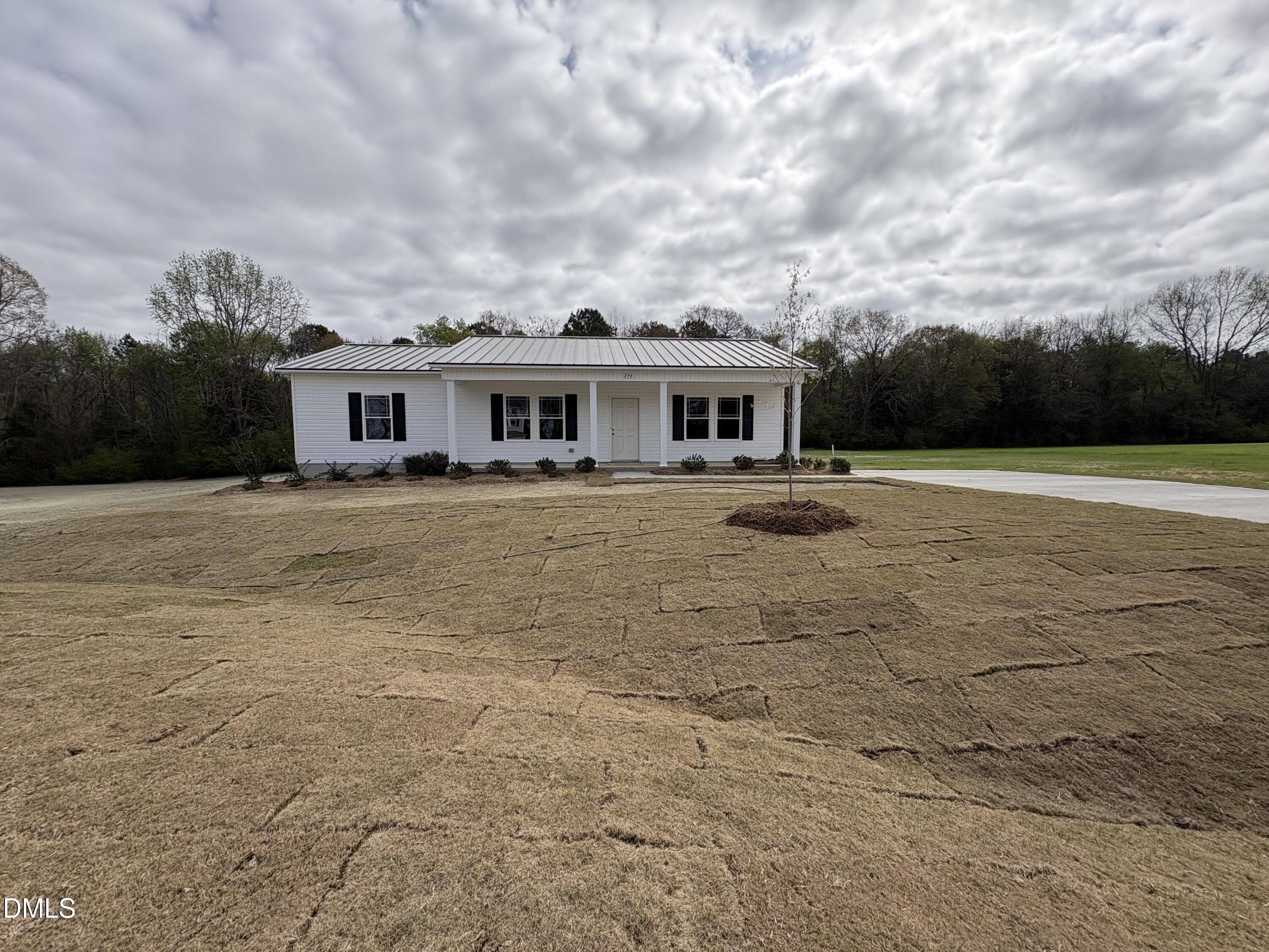 a front view of a house with yard