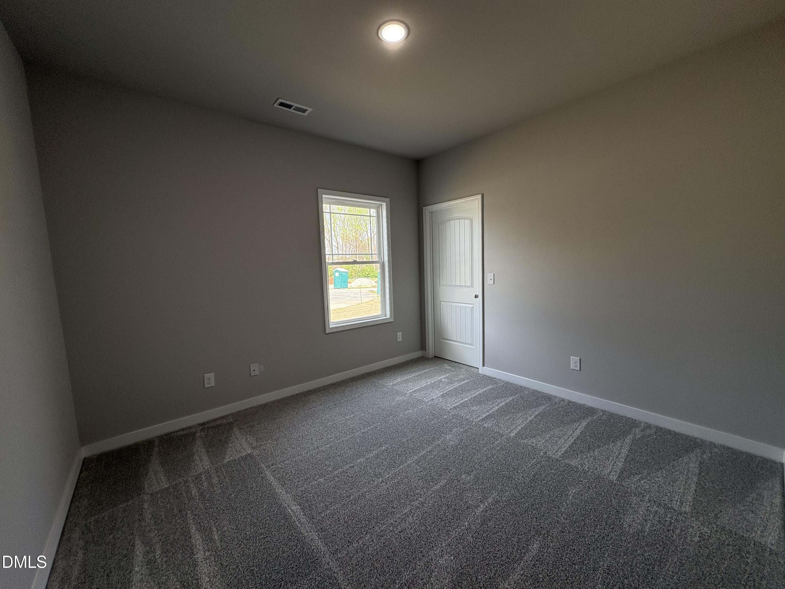 274 Jacobs Ridge Drive Four Oaks, NC 27524 - Photo 12 of 14 a view of an empty room with a window