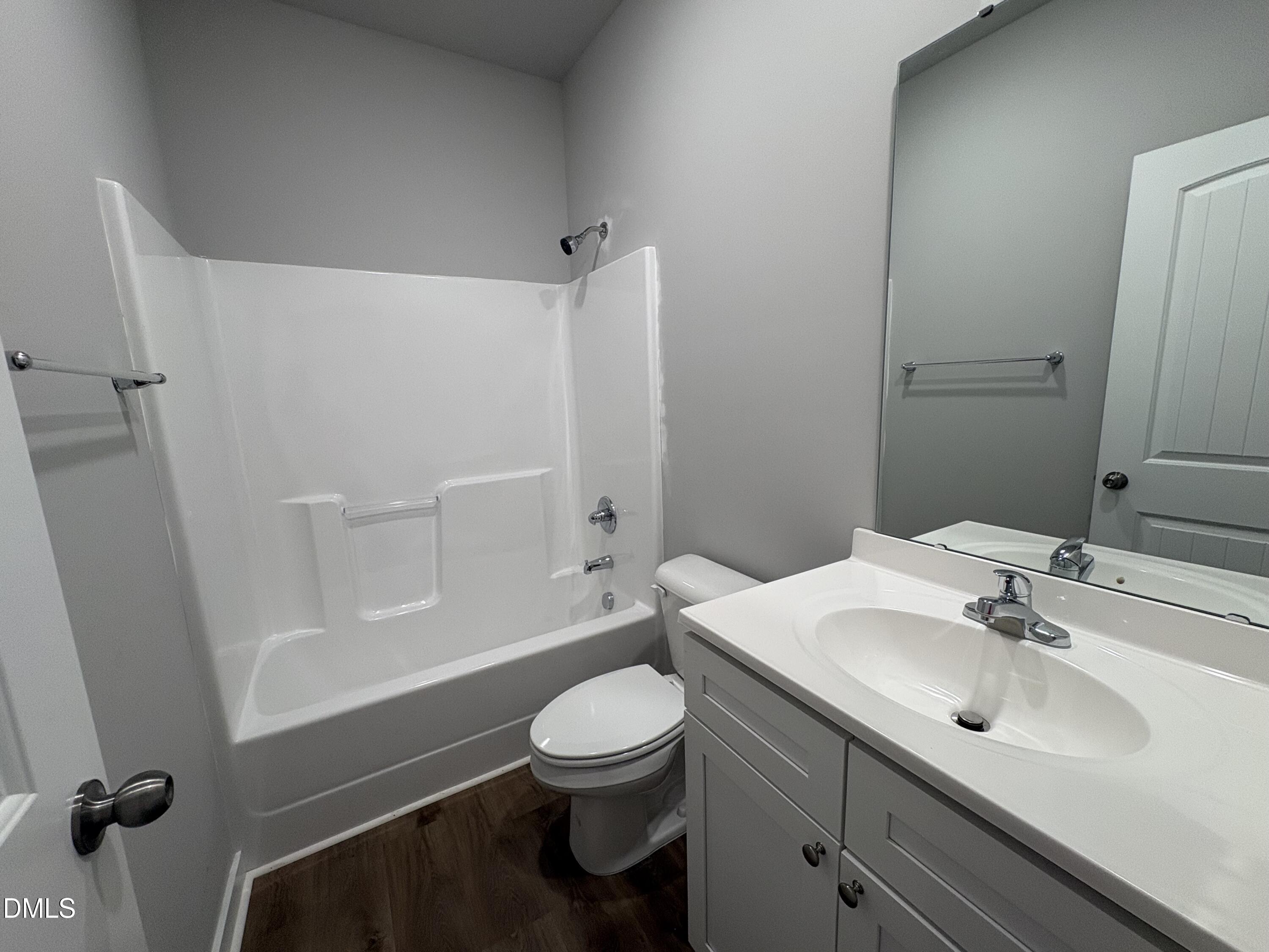 274 Jacobs Ridge Drive Four Oaks, NC 27524 - Photo 13 of 14 a bathroom with a sink a toilet and shower