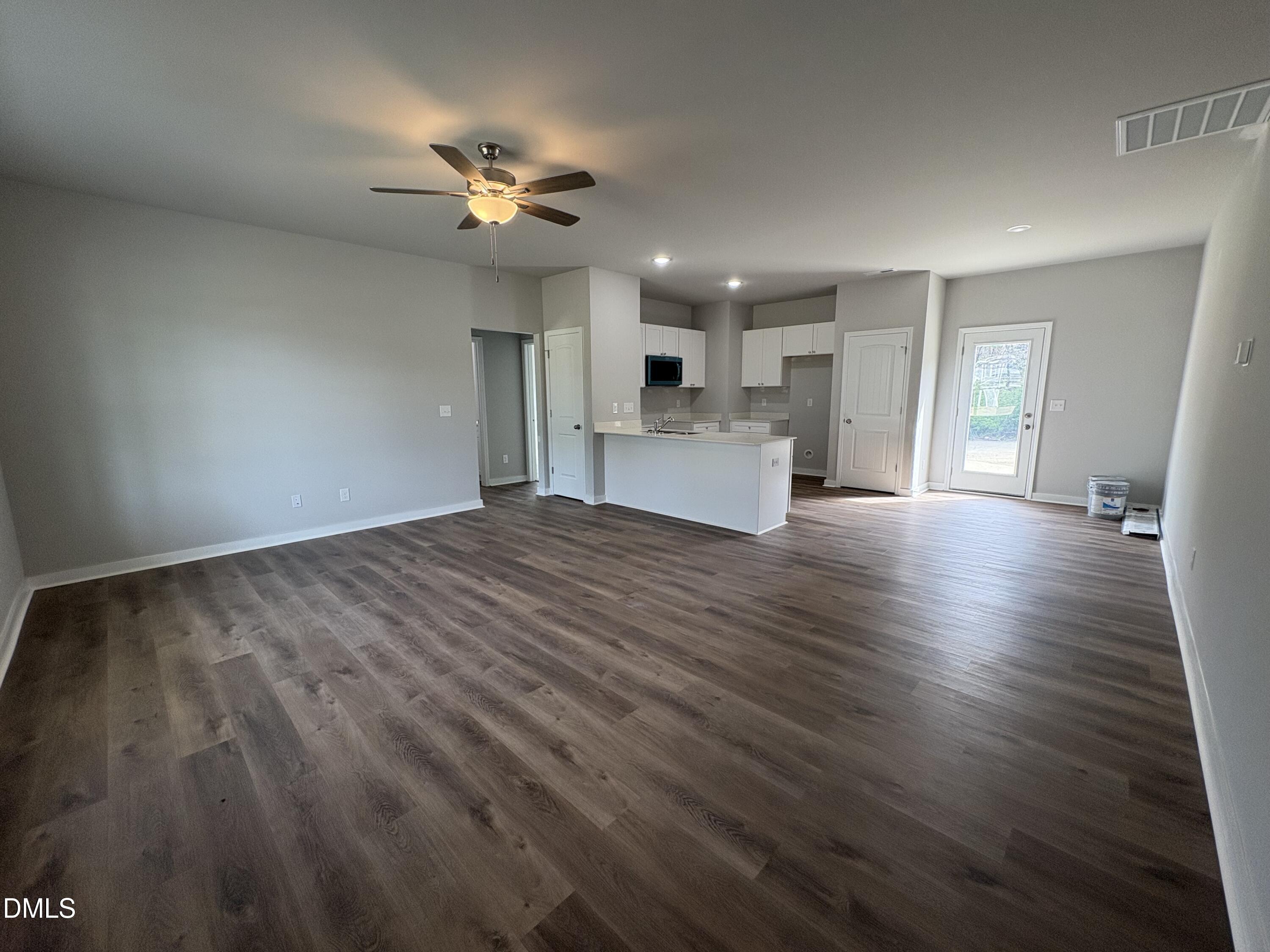 274 Jacobs Ridge Drive Four Oaks, NC 27524 - Photo 3 of 14 a view of empty room with wooden floor and ceiling fan