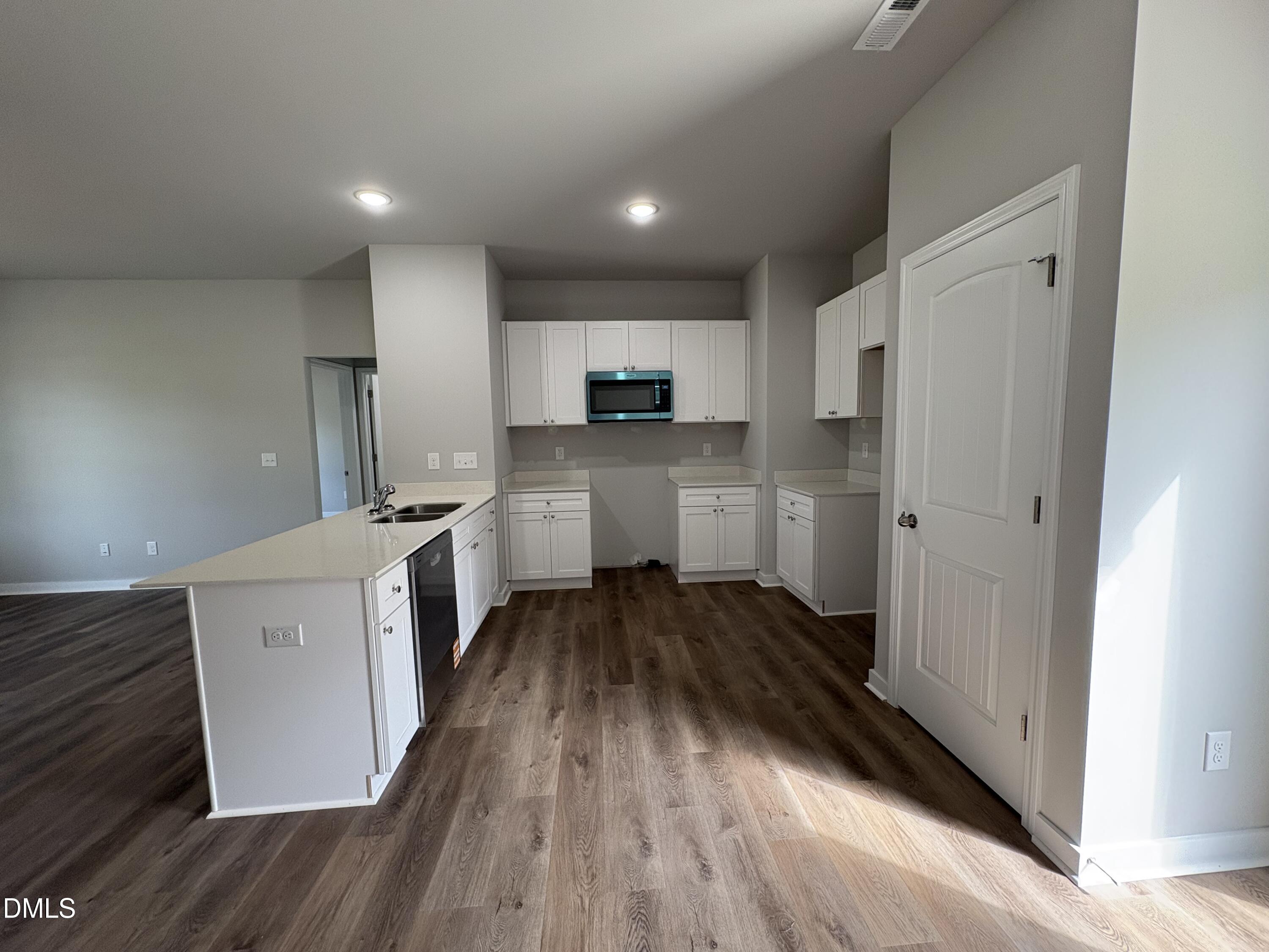 274 Jacobs Ridge Drive Four Oaks, NC 27524 - Photo 5 of 14 a kitchen with a refrigerator and a stove top oven