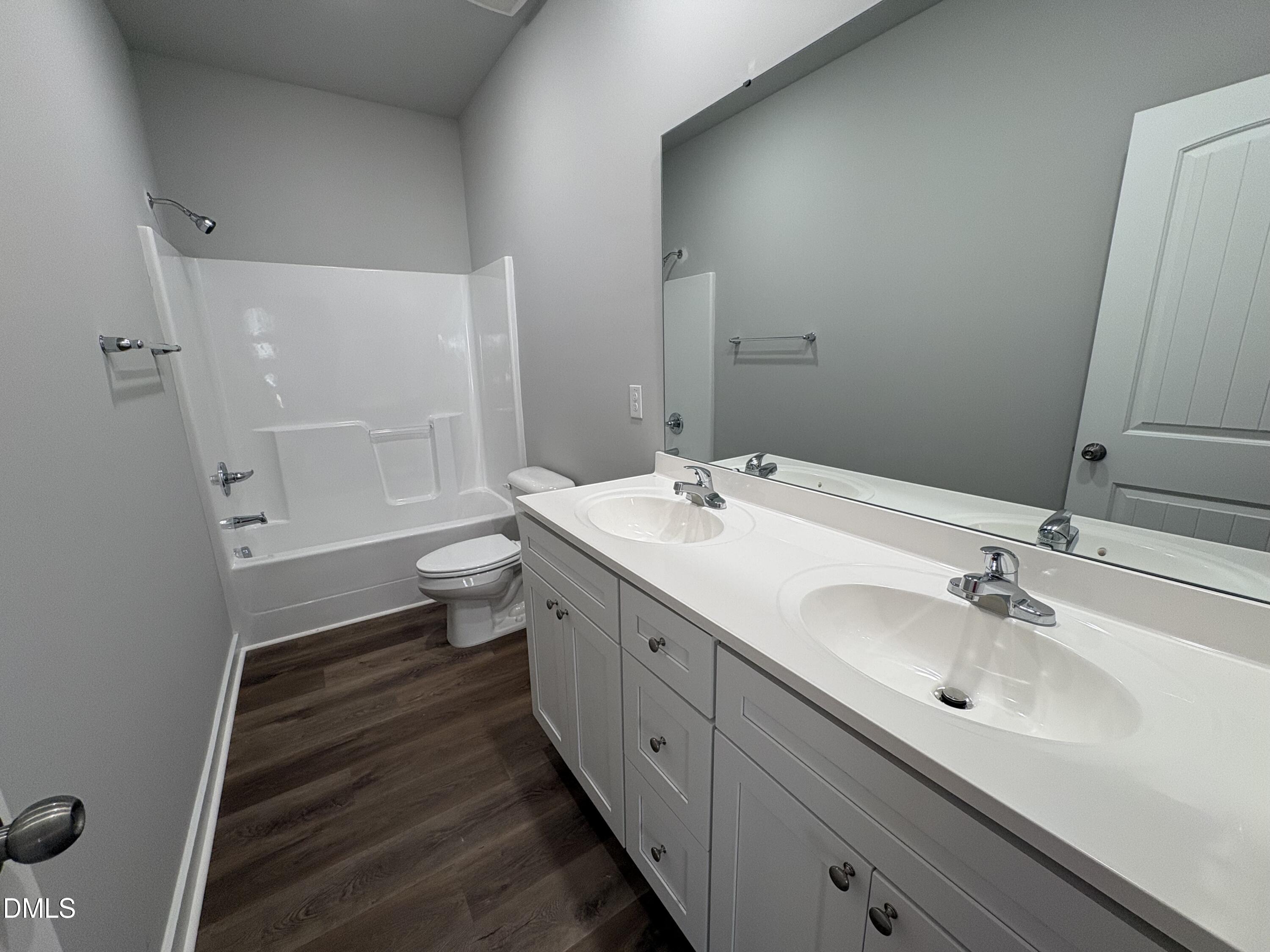 274 Jacobs Ridge Drive Four Oaks, NC 27524 - Photo 8 of 14 a bathroom with a double vanity sink toilet and shower