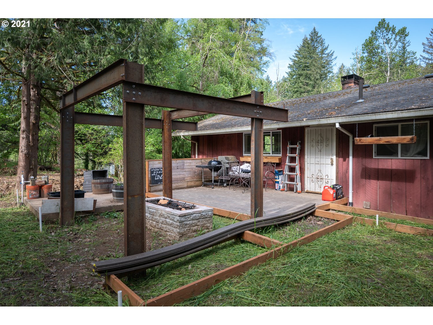 22514 South Redland Road Estacada, OR 97023 - Photo 23 of 28 a view of a backyard with table and chairs couches wooden fence and a yard
